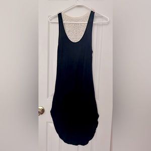 Black dress with lacy flower pattern on back. Size small. Gently used.